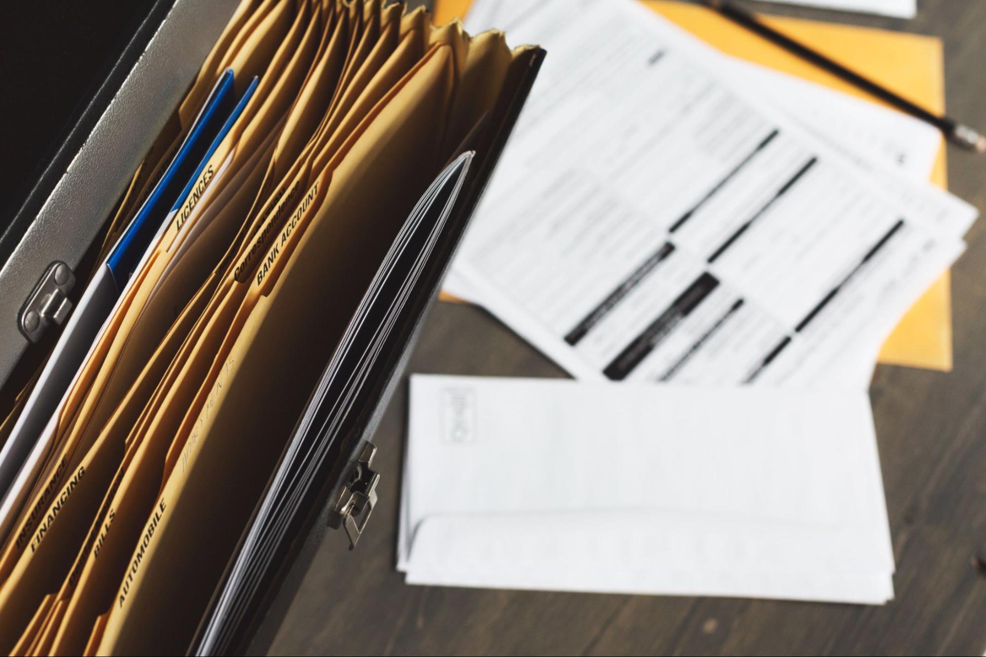 Looking down from above there is a folder, in focus, containing files with different labels such as "Bank account" and "licenses".