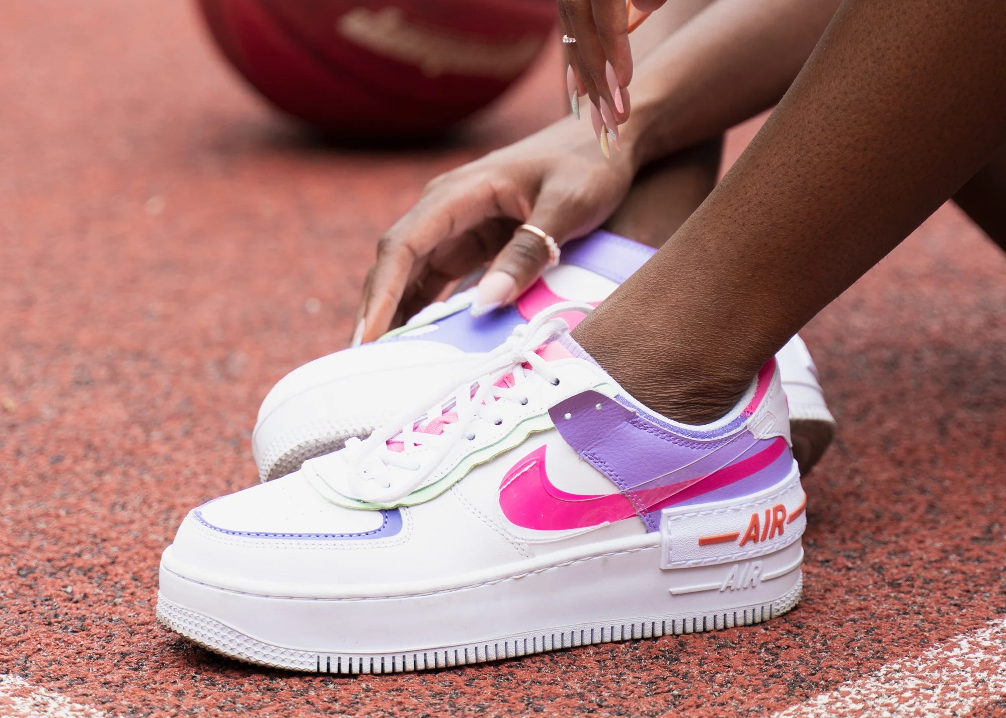 A close up of a woman wearing Nike sneakers