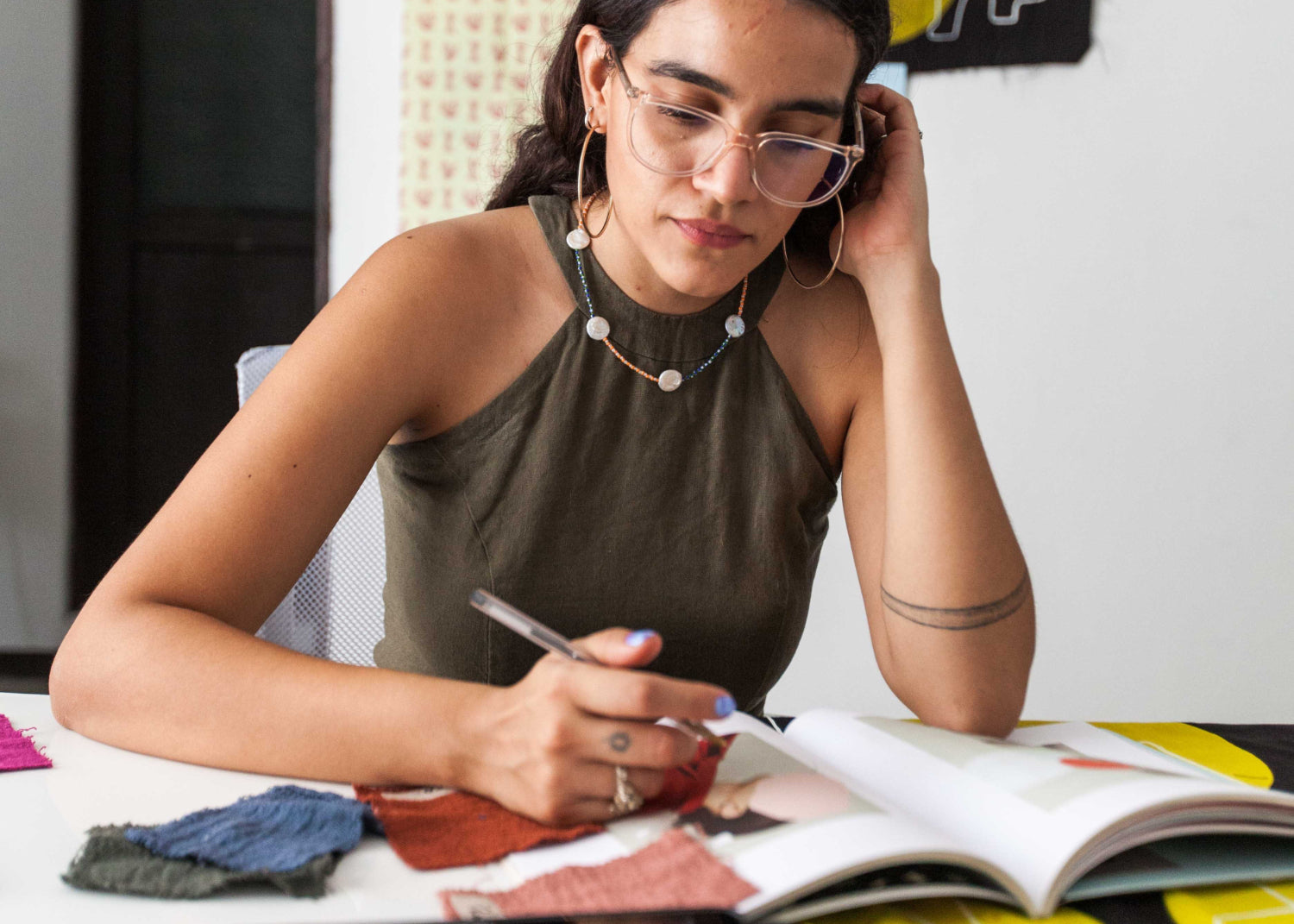 WOman sits at a design designing a brand