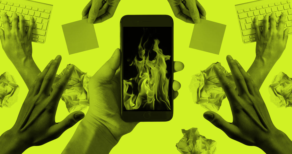 Collage of hands reaching towards devices like phones and keyboards. The image on the screen of a phone at the center shows a burning fire