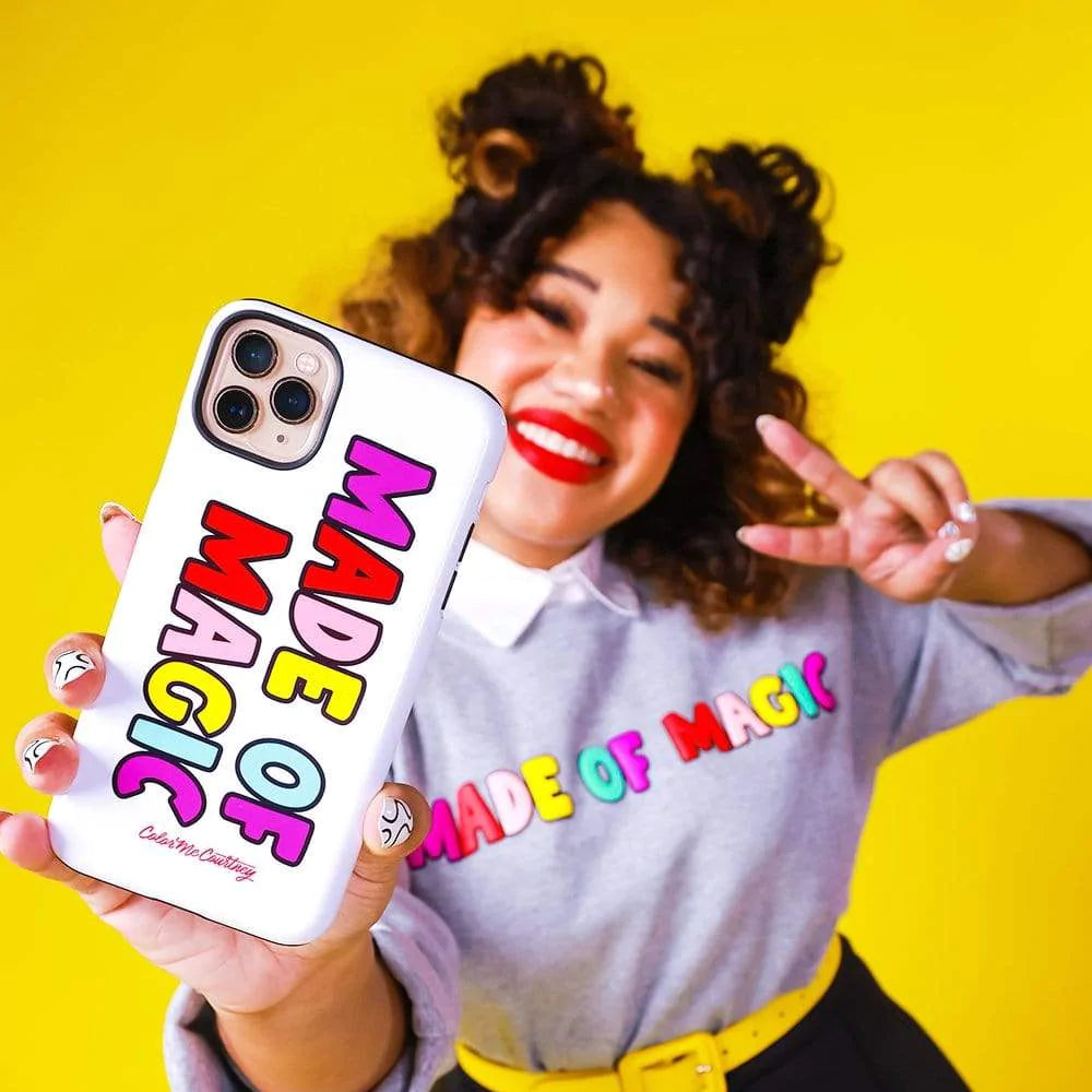 Influencer Color Me Courtney shows off a branded phone case from her merch line