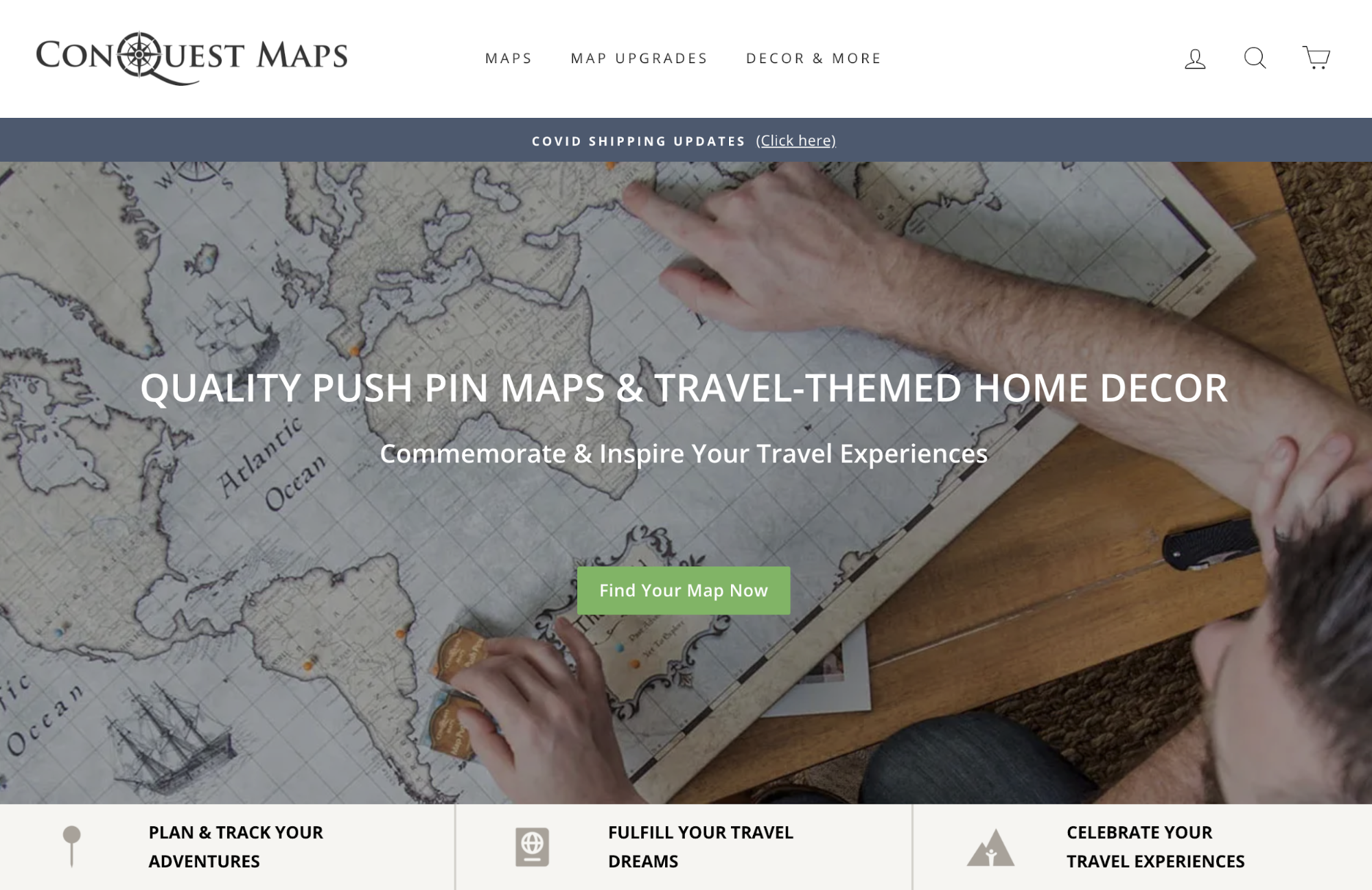 Conquest Maps homepage with a person pointing at a large paper map