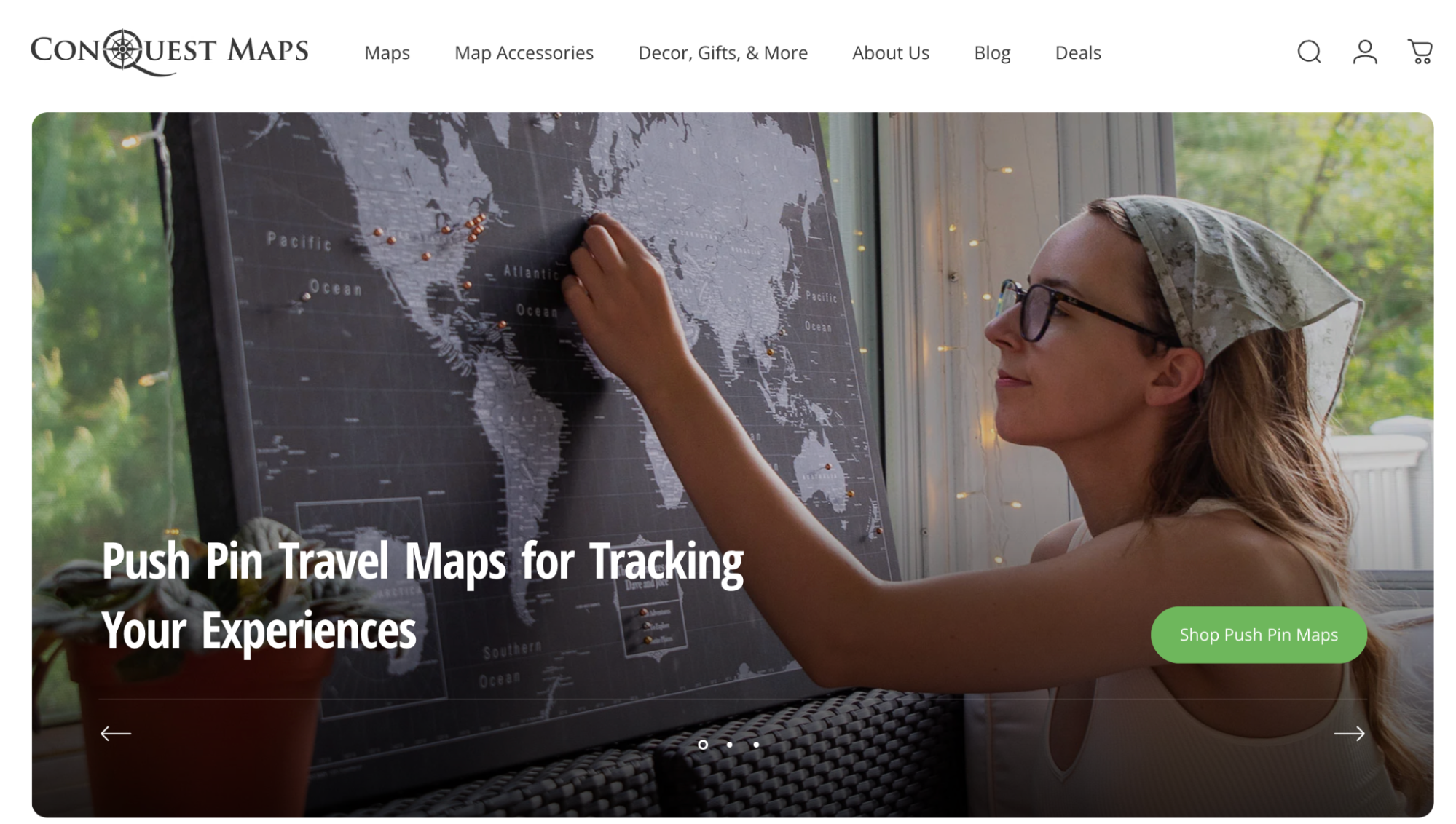 Photo of a woman placing a pin into a world map, symbolizing travel experiences.