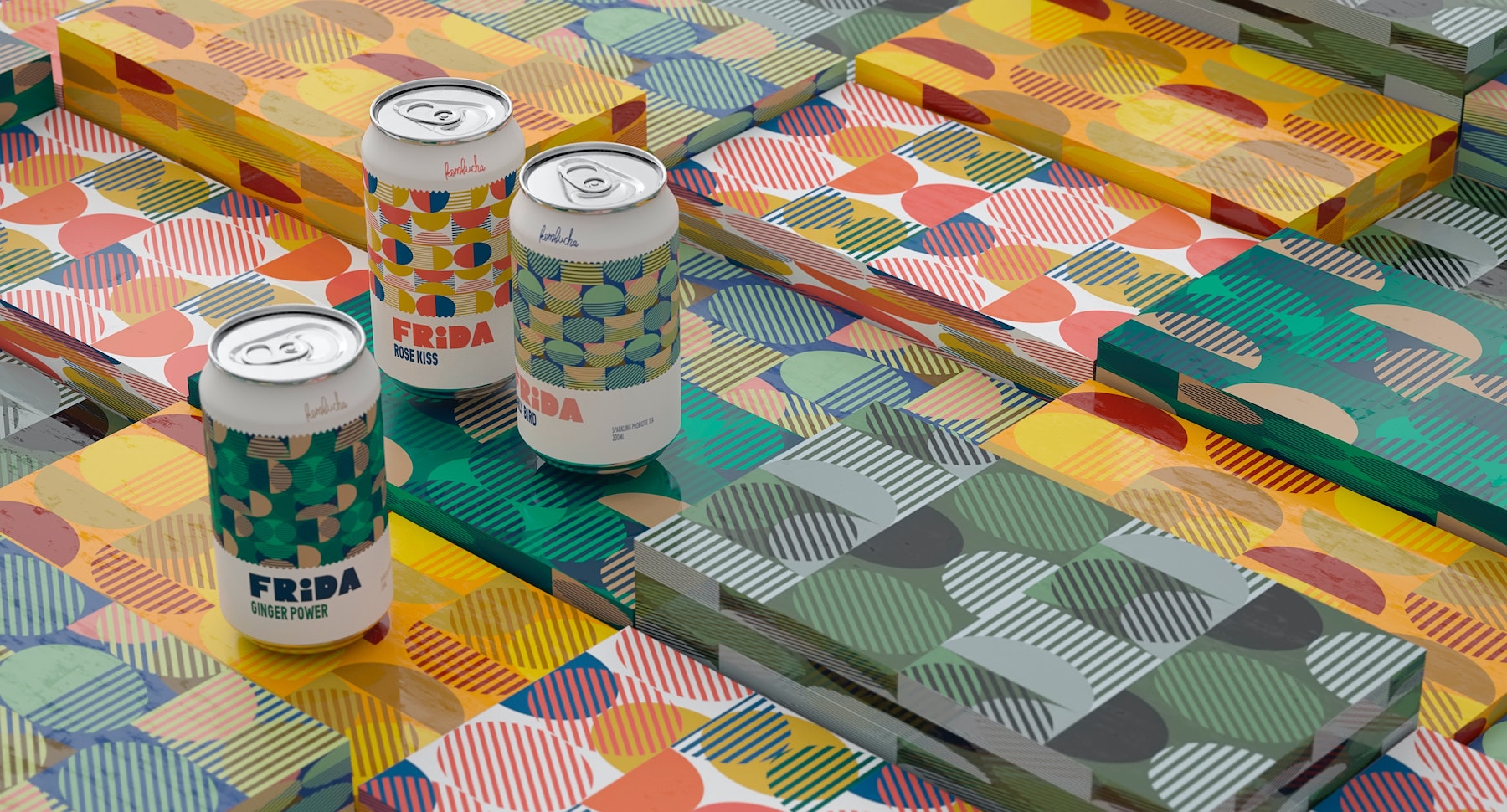 Cans of kombucha sit atop colorful boxes