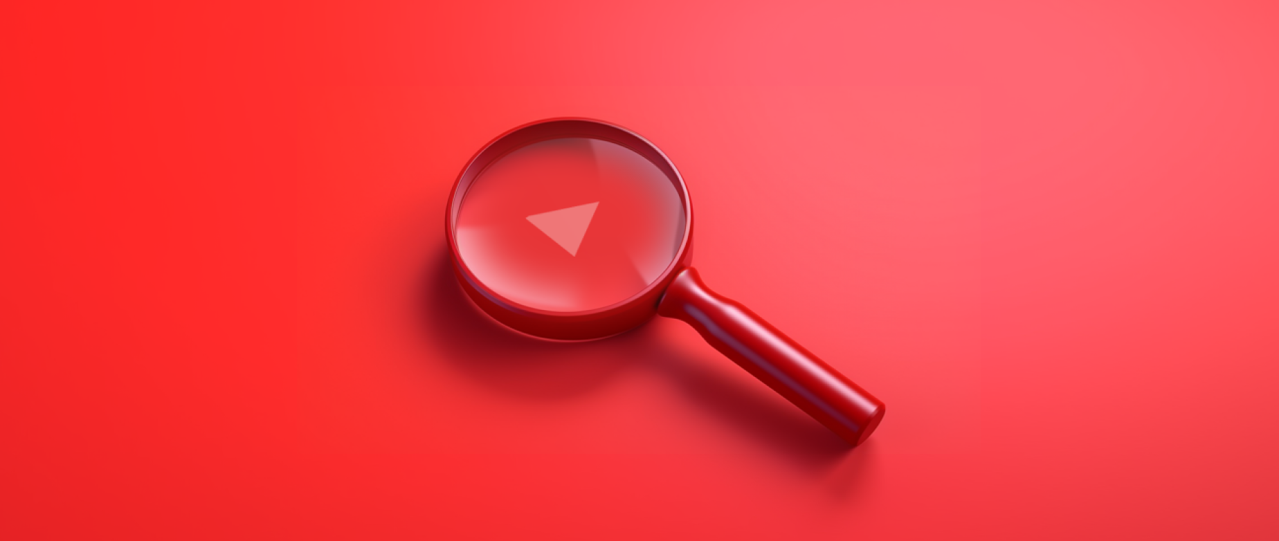 red magnifying glass with the YouTube play button in the middle of it: discovery ads youtube