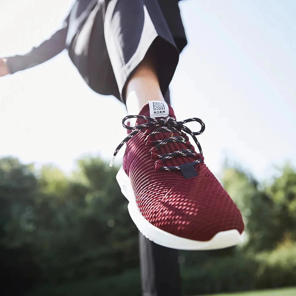 A close up of a person's foot in a sneaker