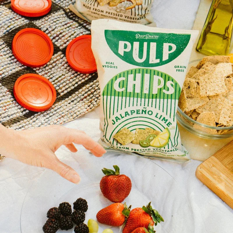 A bag of Pulp Chips arranged in a picnic spread