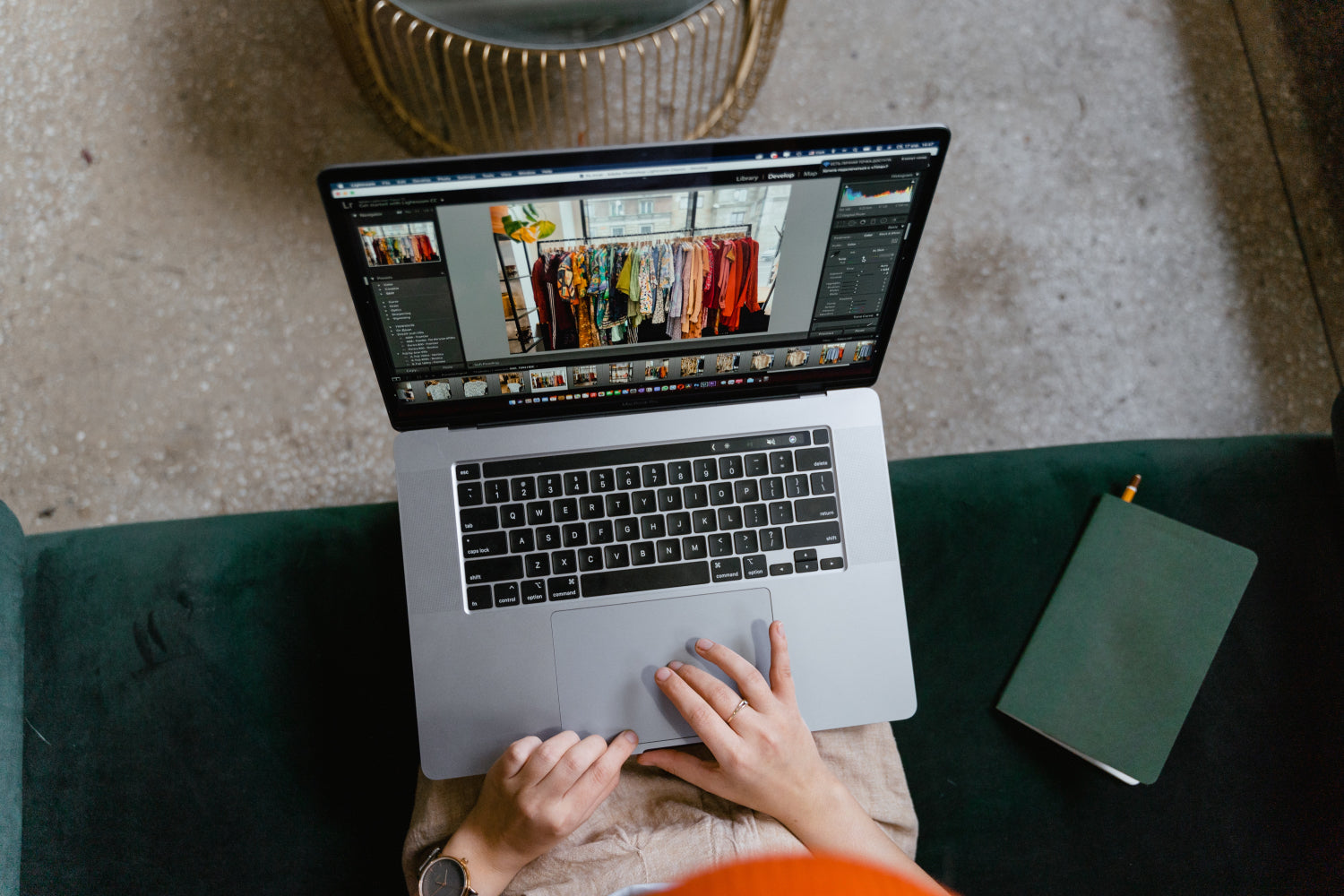 A person types on a laptop