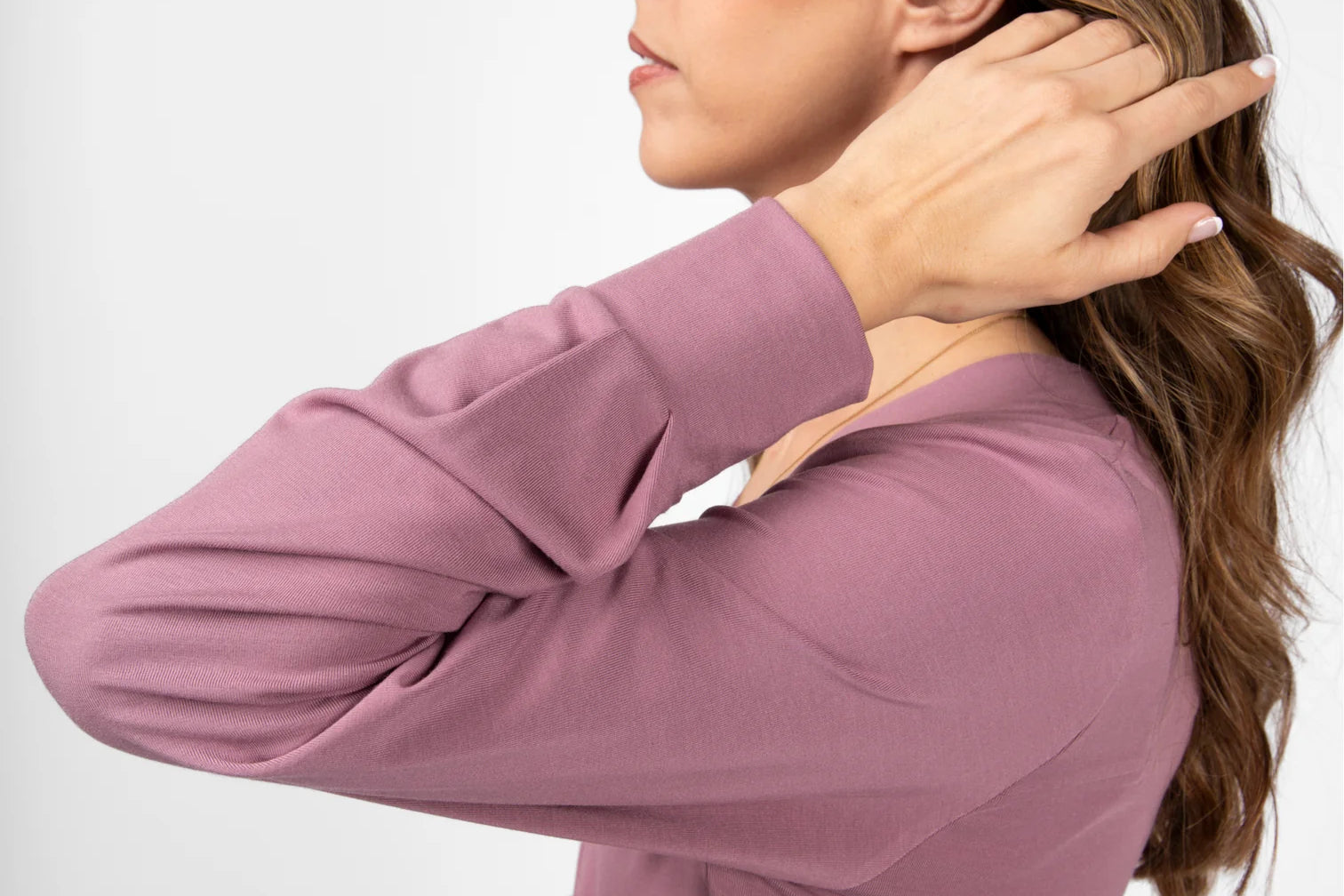 A woman models a light purple top