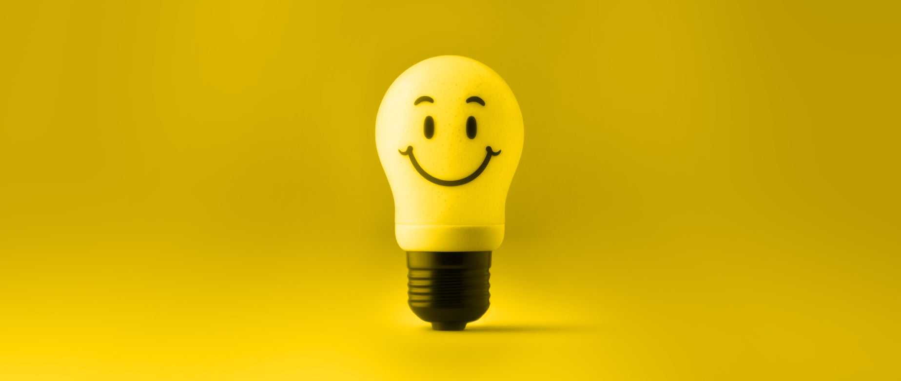 a yellow lightbulb with a smiley face on it: entrepreneurial traits