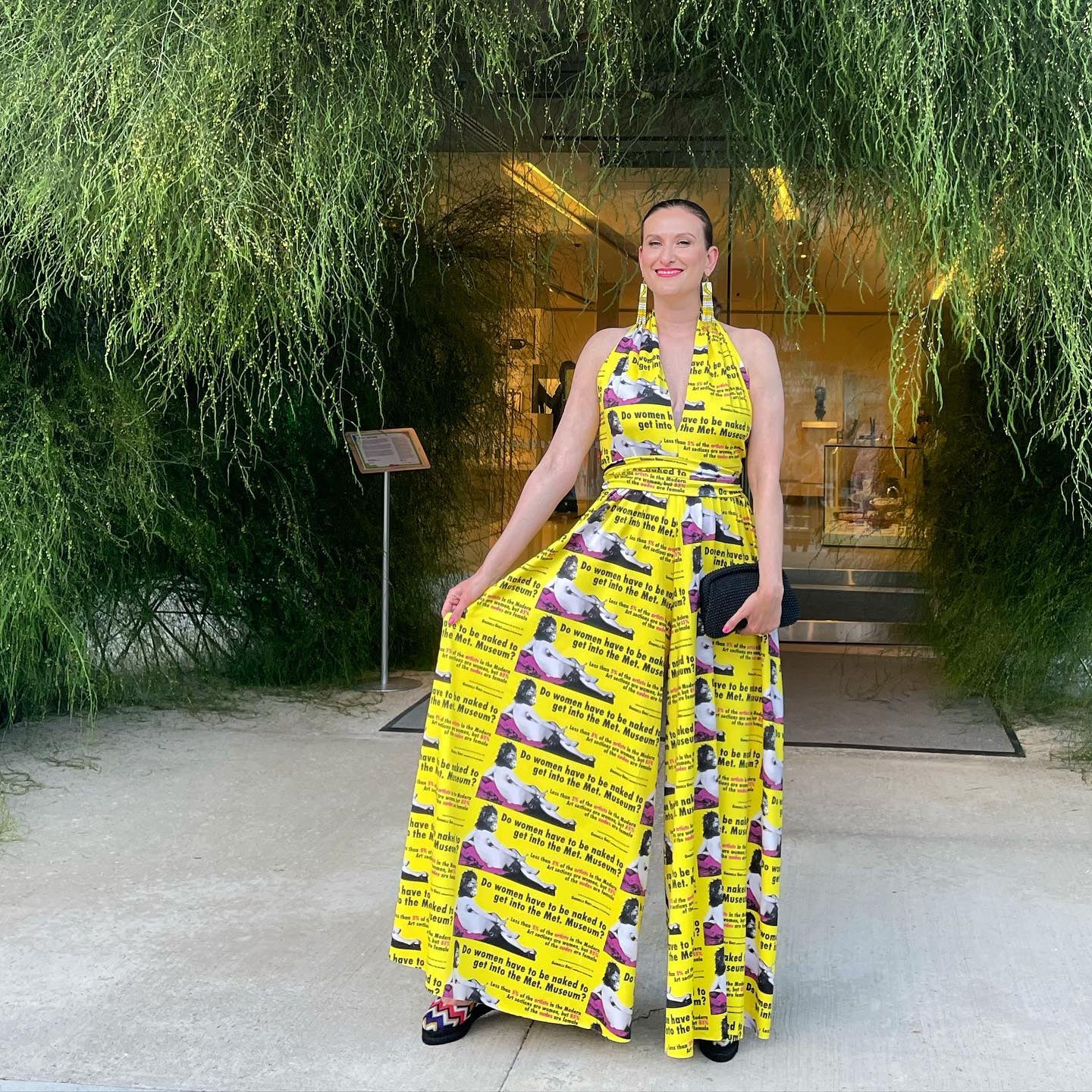 Portrait of Odessa Paloma Parker wearing a yellow halter jumpsuit