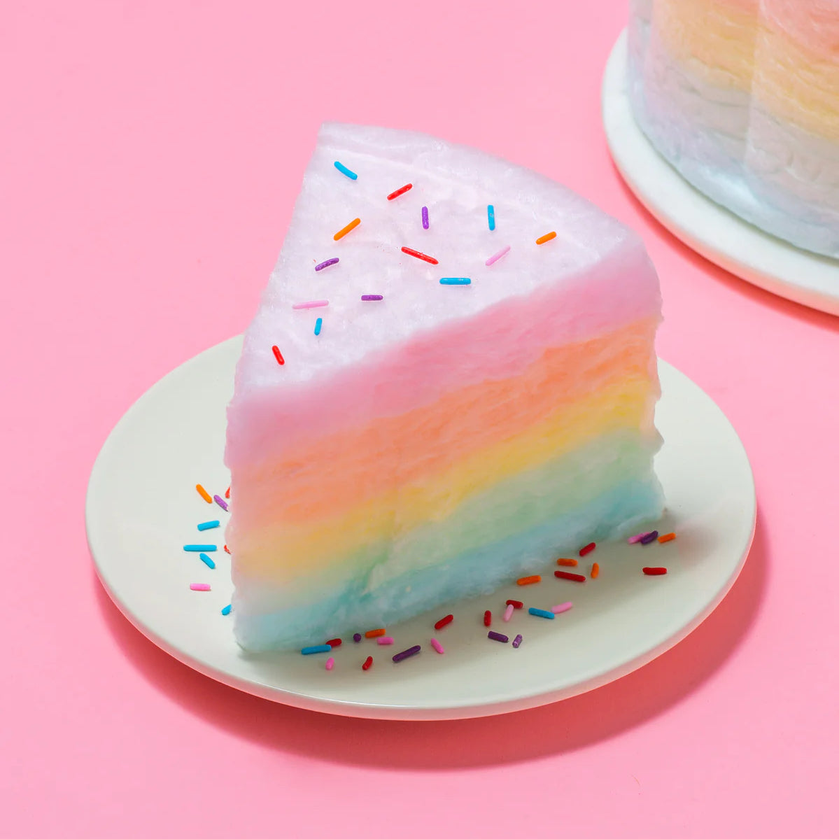 A slice of Floof rainbow cotton candy cake