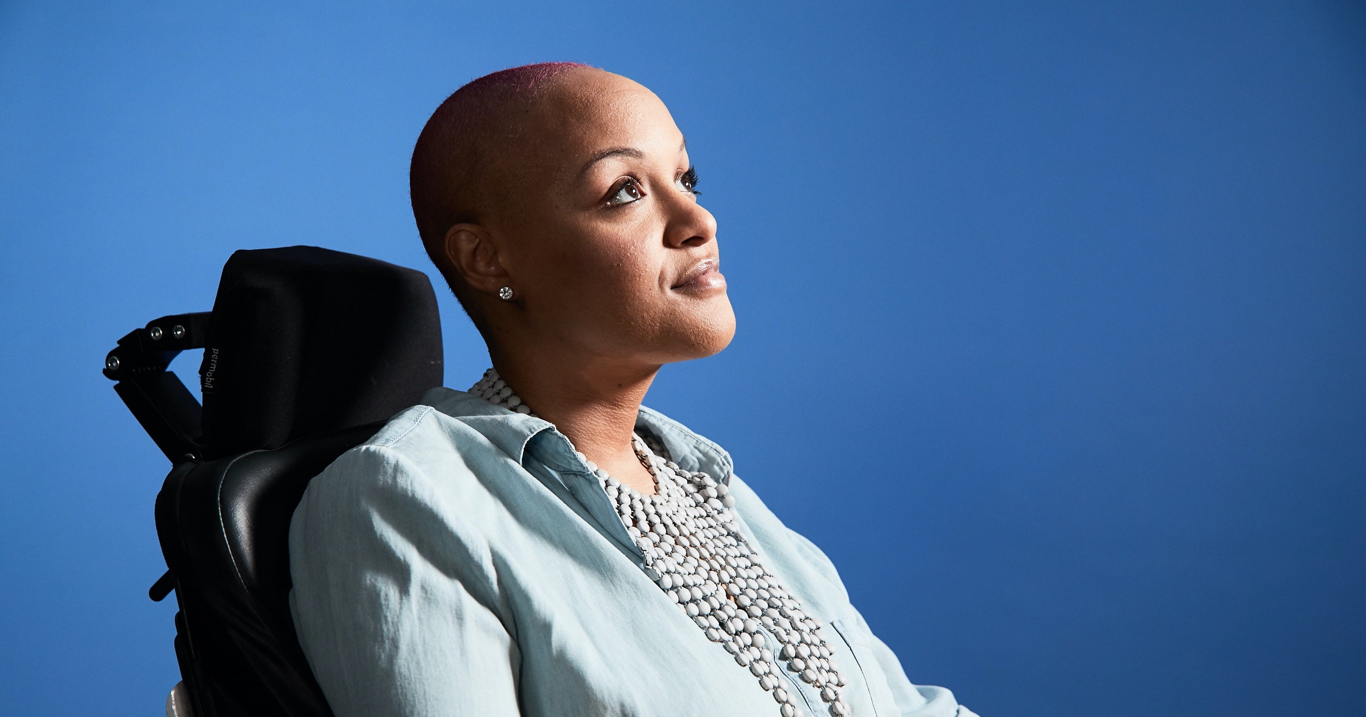 Portrait of Keisha Greaves against a blue background