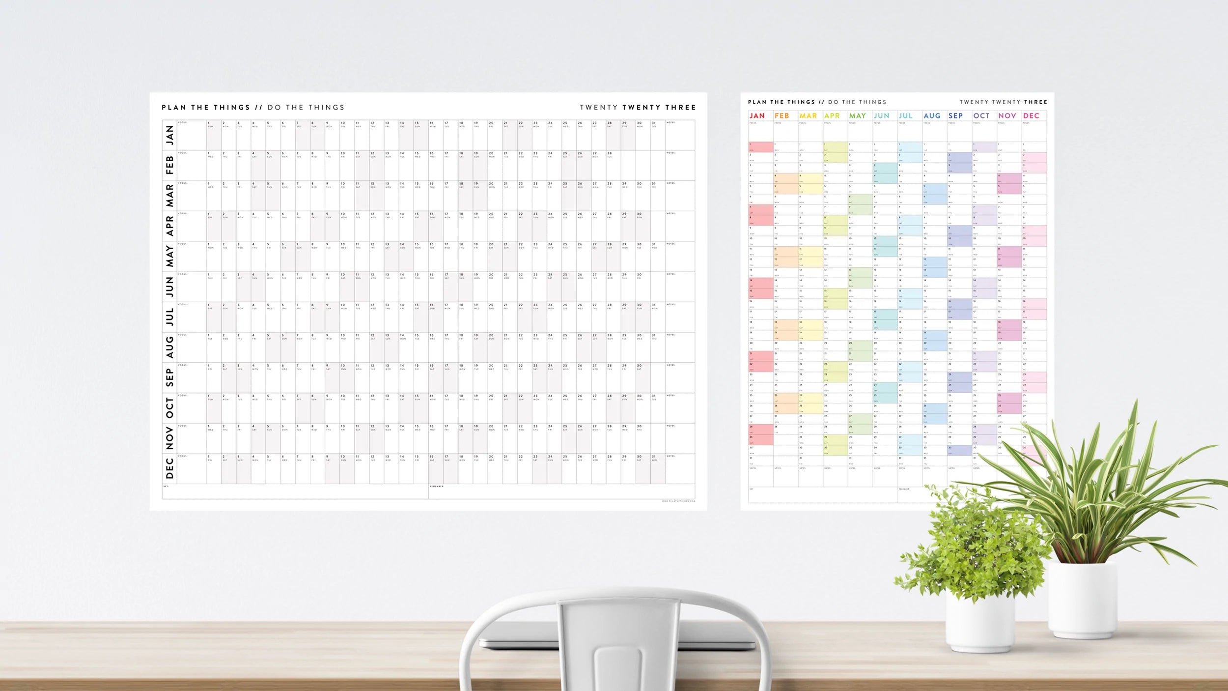 Two large year-view calendars mounted on a wall 