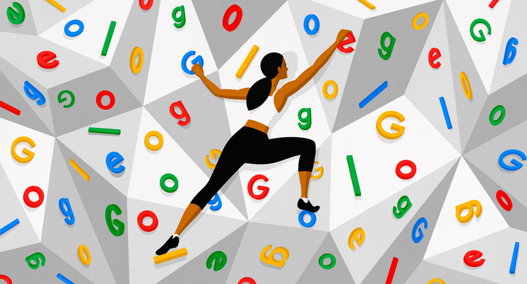 woman climbing rock wall of google letters