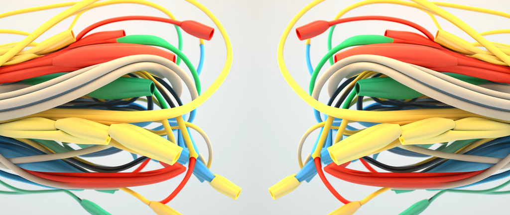 an illustration for a blog post about google ad extensions. It shows a variety of cables in different colors