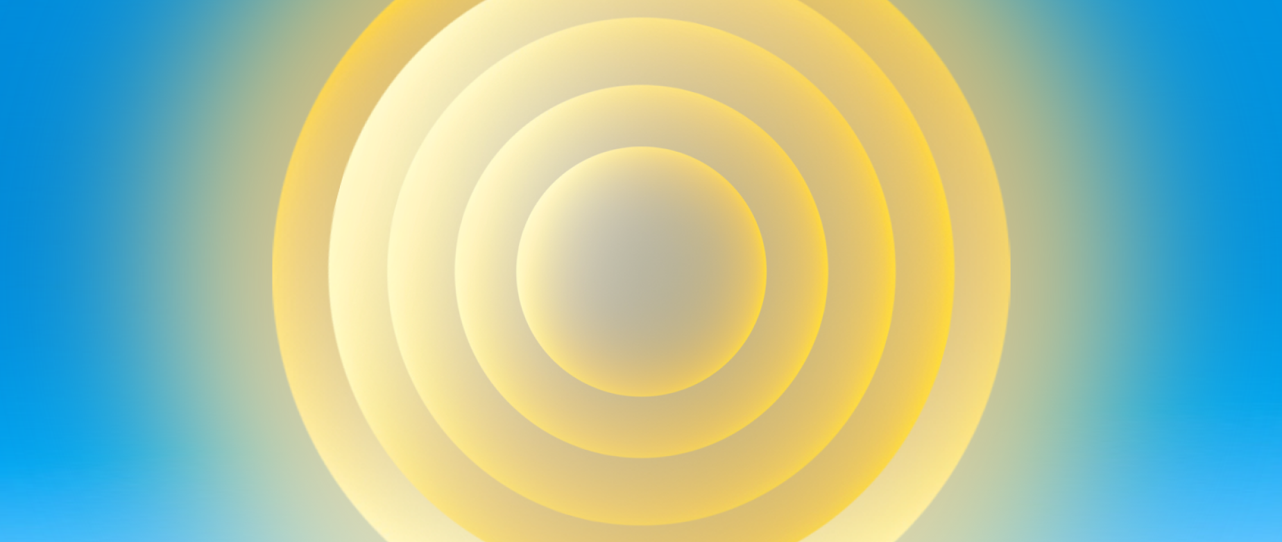 Yellow rings inside of one another shining onto a blue background.