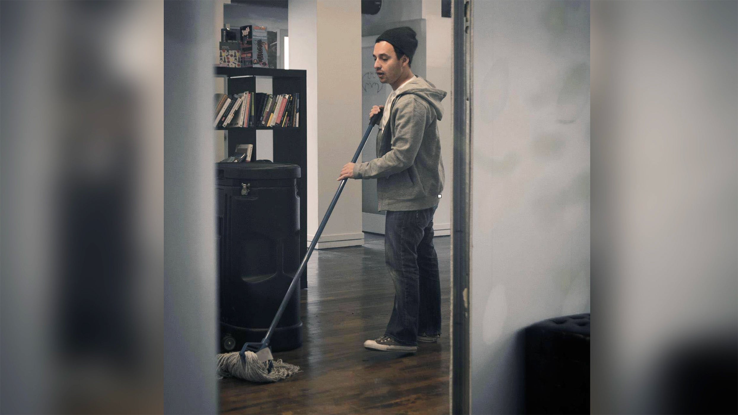 photo of harley sweeping the floors of the shopify office