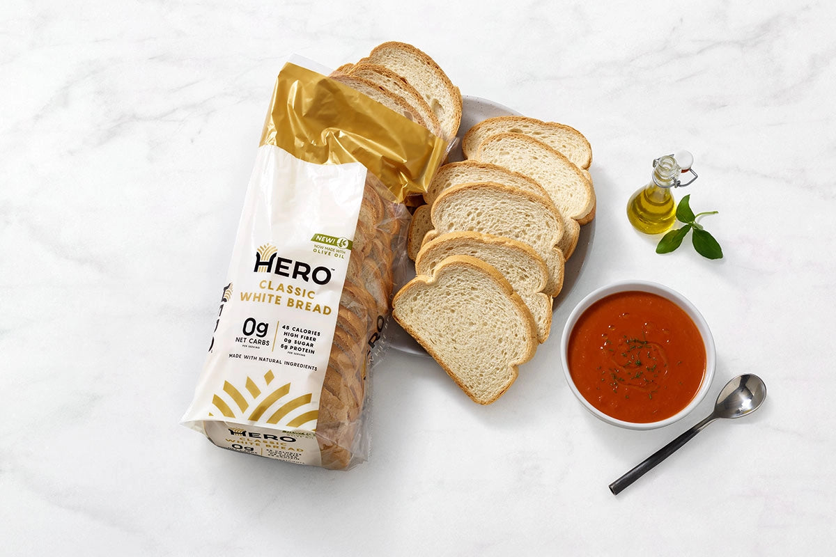 A lifestyle photo of Hero Bread arranged with condiments