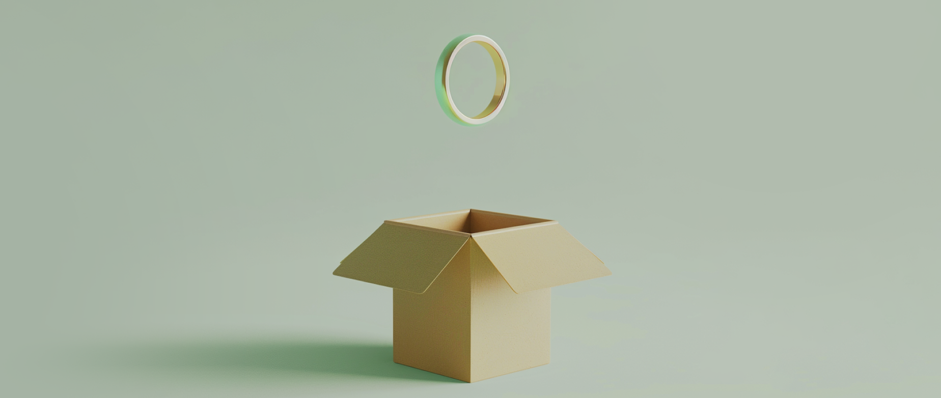 A gold ring above an open cardboard box on a grey green background.