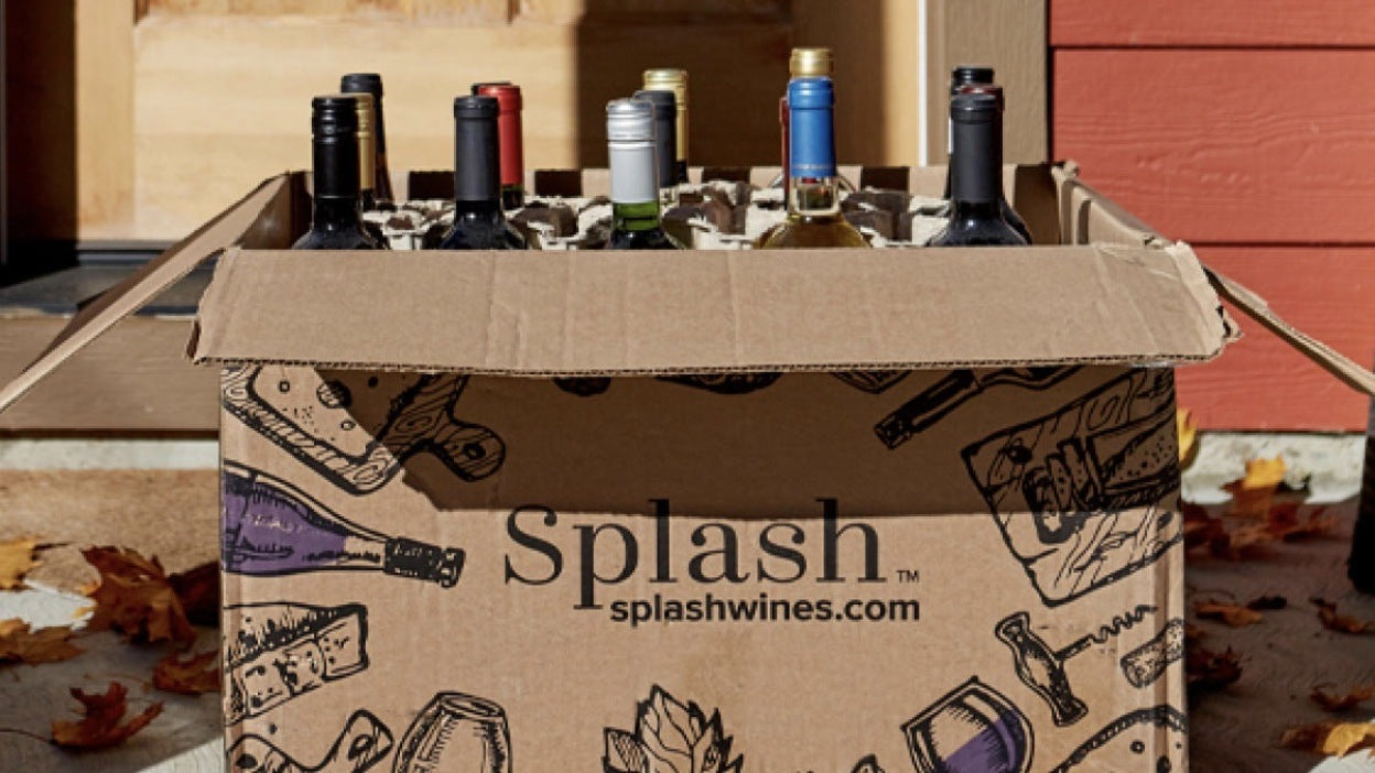 Splash wines subscription box opened to show curated wine bottles inside.