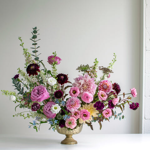 A Wild North Flowers arrangement with purple and white flowers.