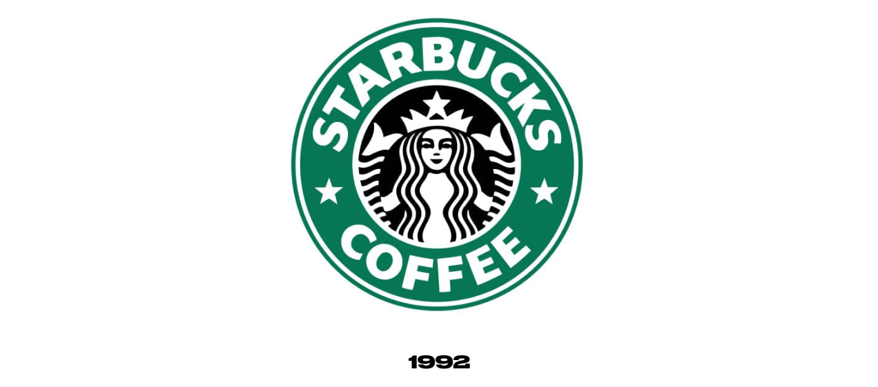 Starbucks logo from 1992. Nearly identical to the 1982 logo, only now the face of the Siren has been enlarged and its bottom half is no longer visible. The siren is still surrounded by a green circle reading "Starbucks Coffee".