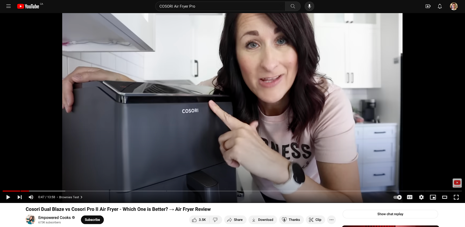 An influencer demonstrates the features of an air fryer in a promotional YouTube video.