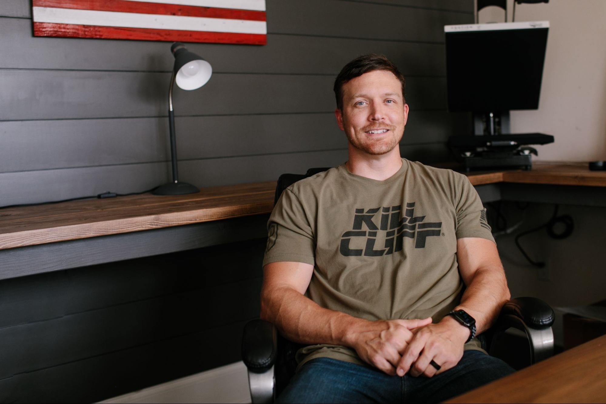 Ryan Roberts, the Director of Ecommerce at Kill Cliff sitting in an office setting.