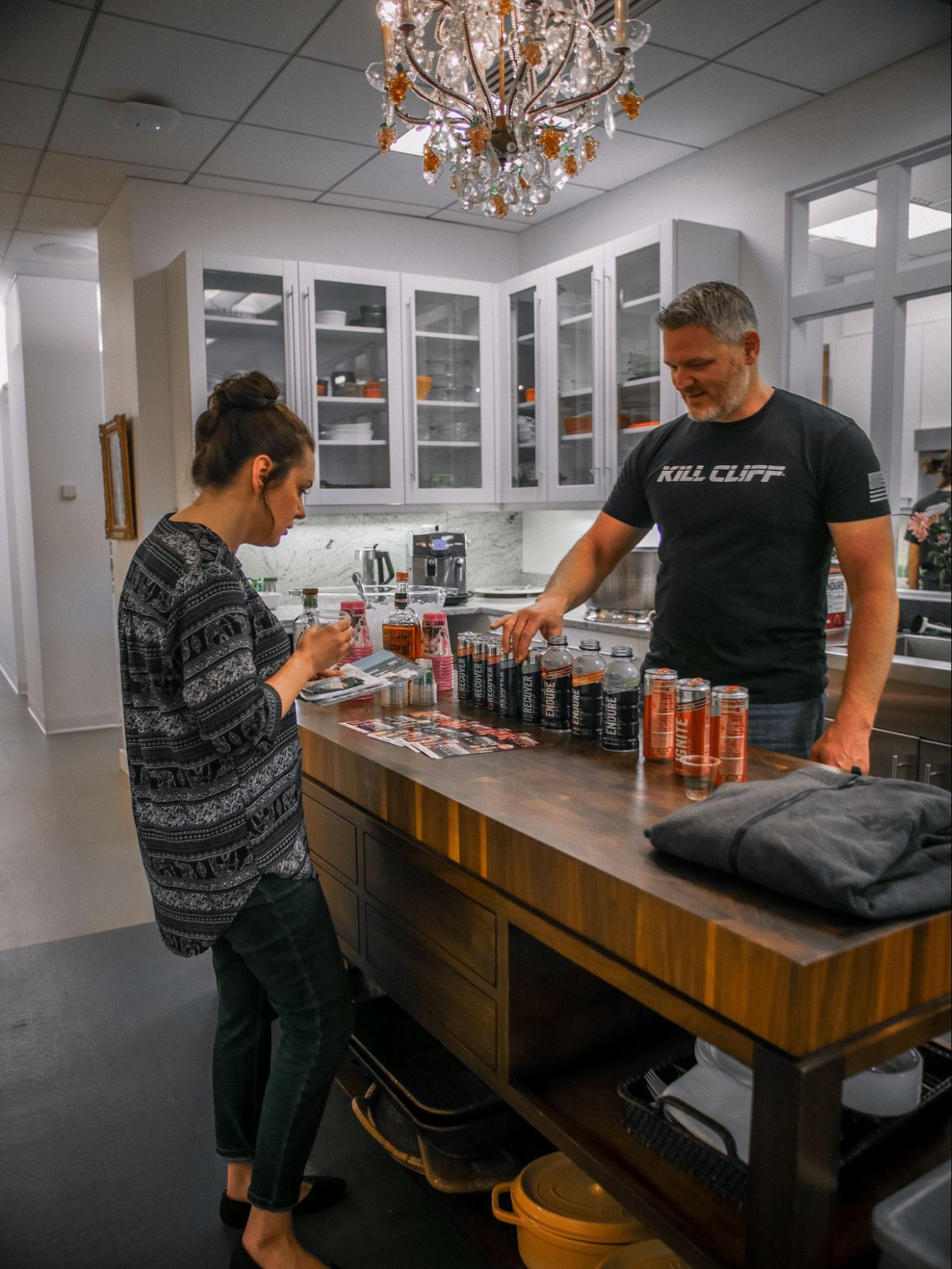 A couple tests different flavours of Kill Cliff beverages within a kitchen setting.