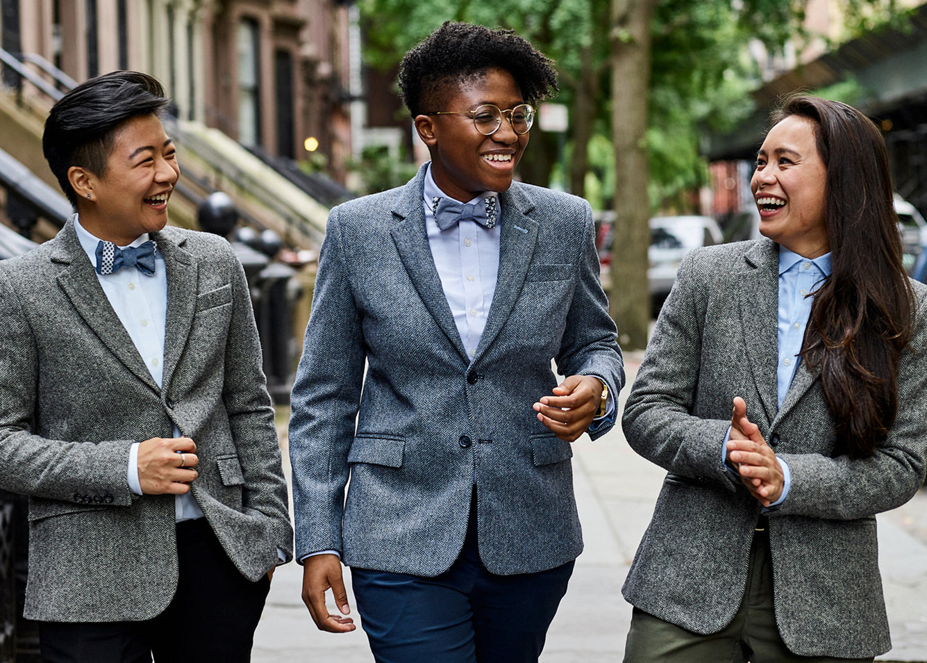 Three models wearing suit sets made by Kirrin Finch.