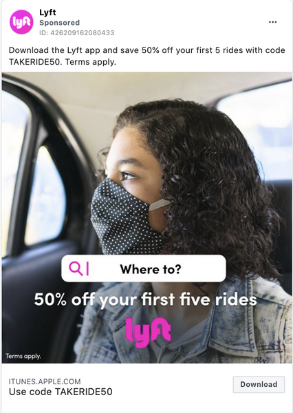 A Lyft ad with a person wearing a face mask and a denim jacket riding in a car.