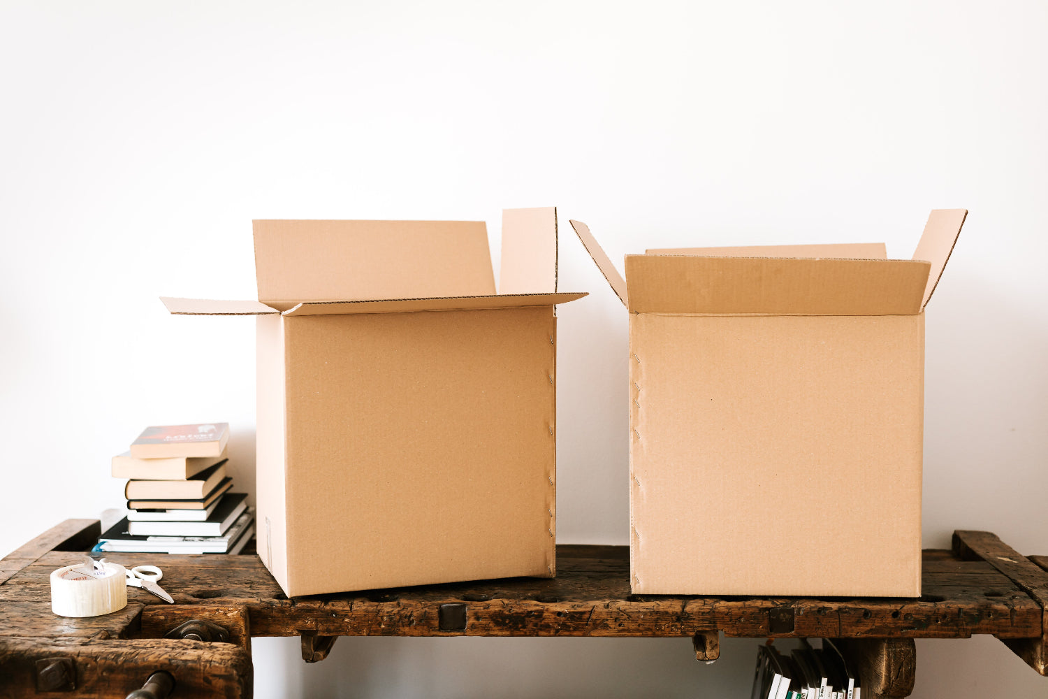 Two cardboard boxes open on a table