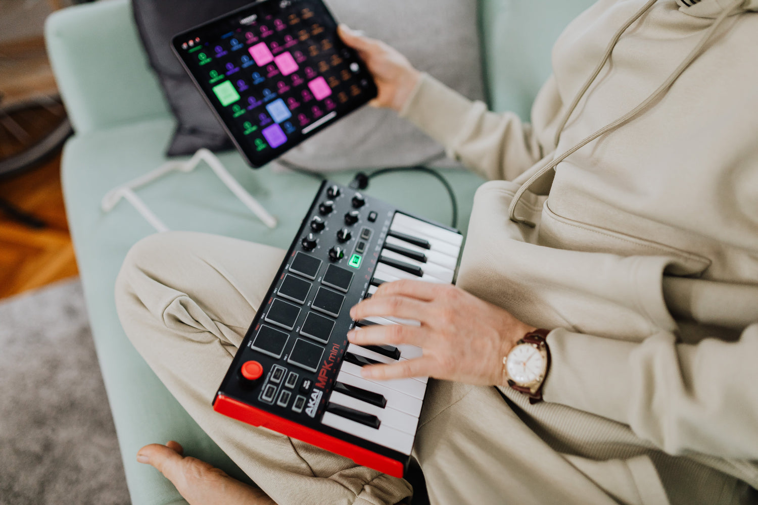 A person makes music on an electronic keyboard