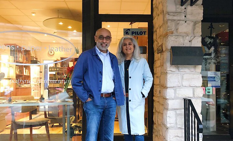 Mano and Baldeep Duggal stand in front of their store, Phidon Pens.