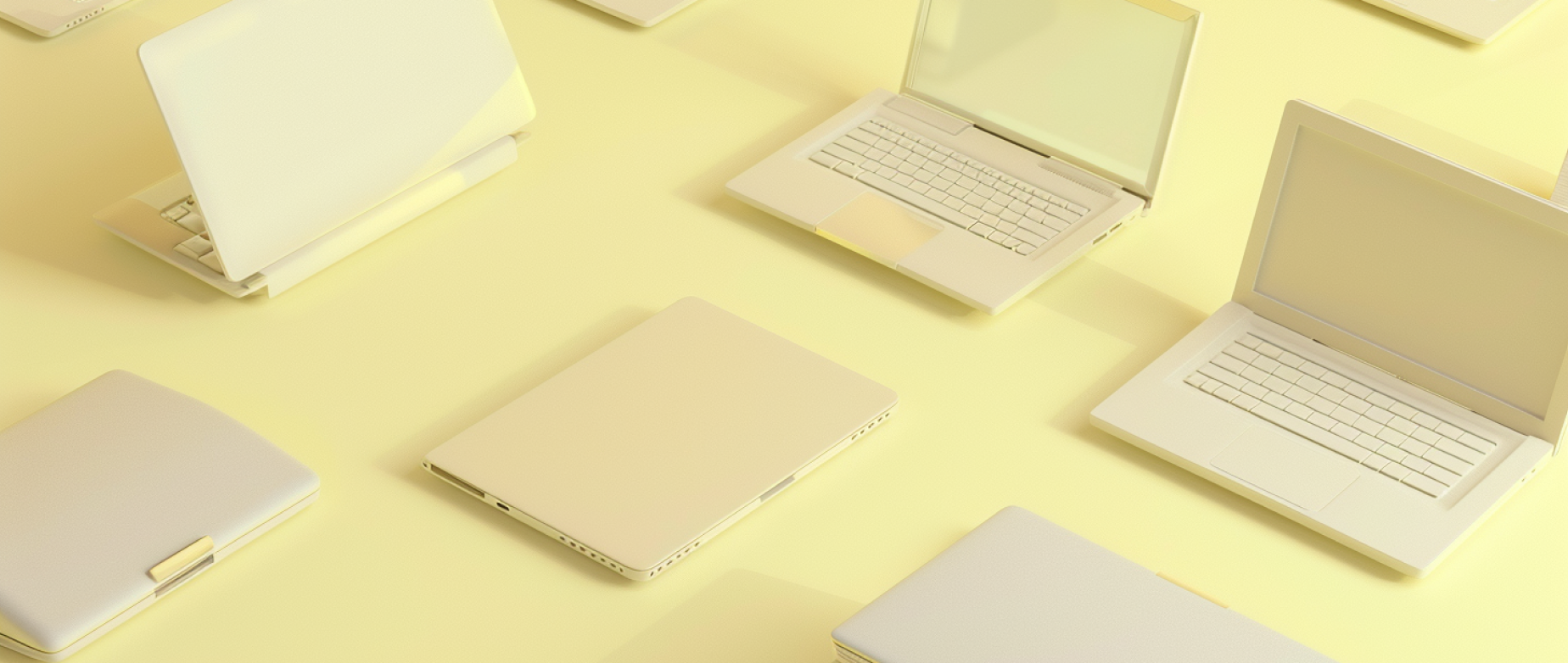 A series of open and closed laptops on a light yellow background.