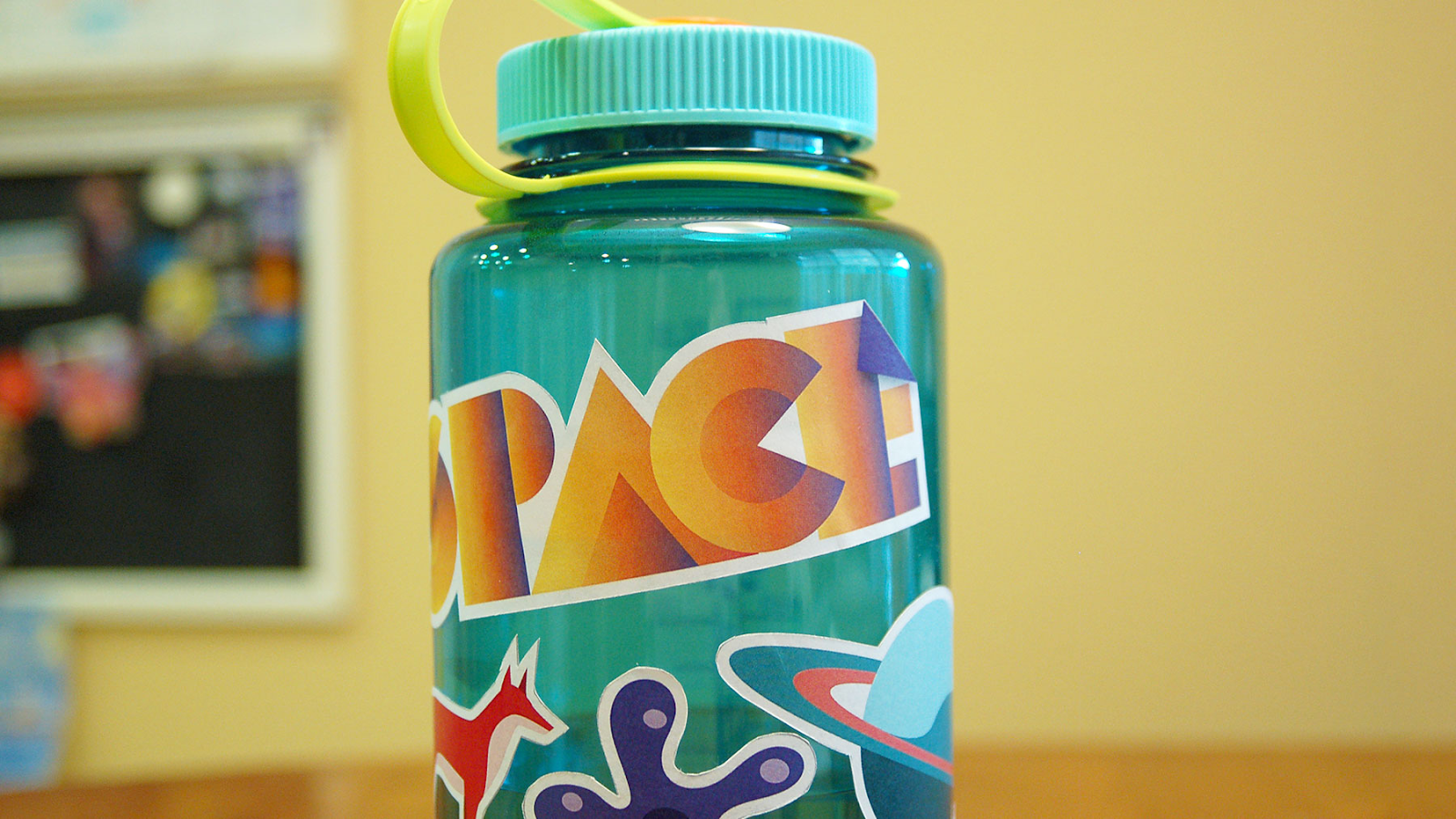 A sticker made using Adobe Illustrator is applied to a Nalgene water bottle.