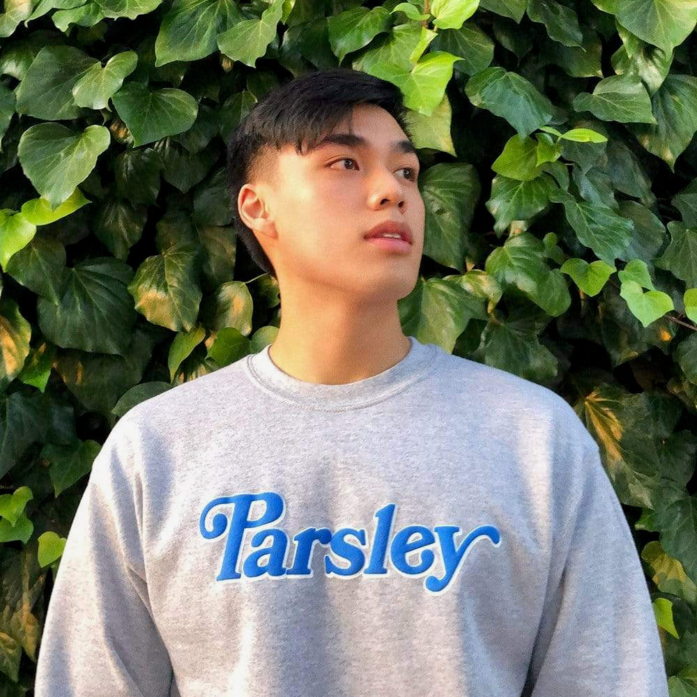 Food creator Newton Nguyen wears his Parsley crewneck sweater. 