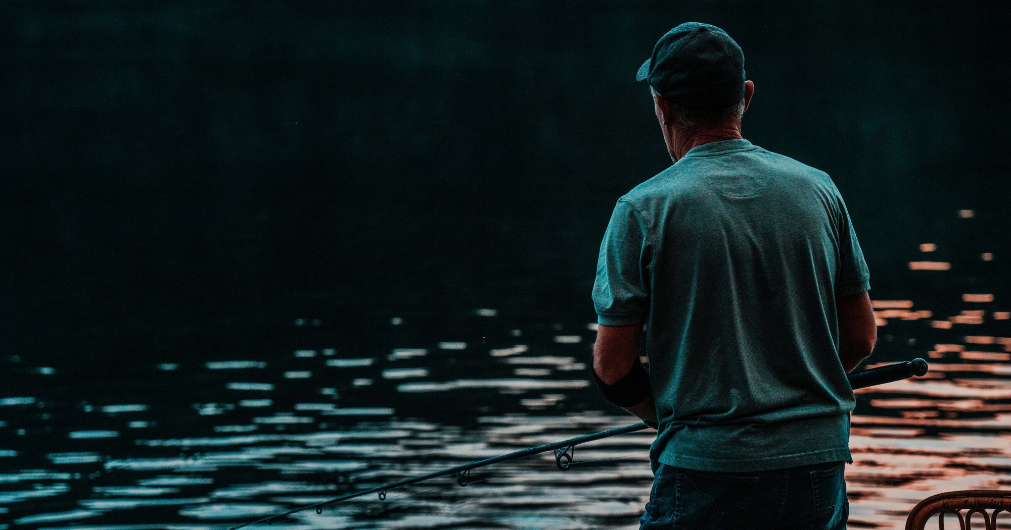 Old man fishing in a lake