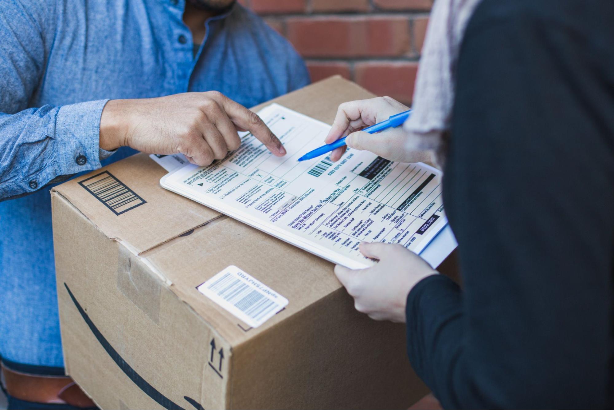 Two business people exchanging a B2B package.