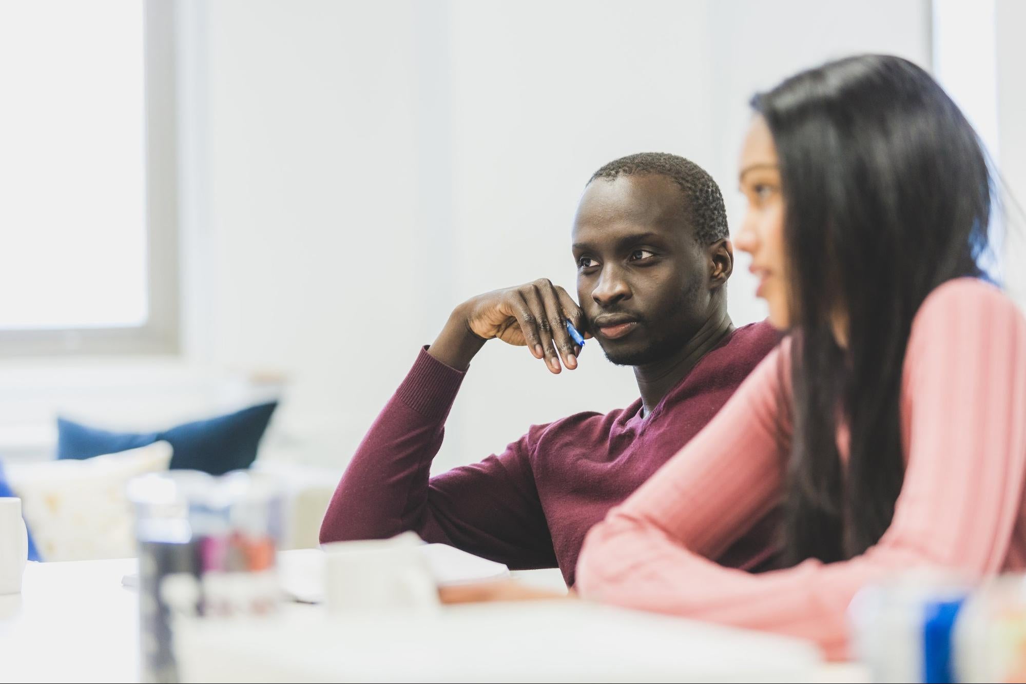 Two people deciding on how they’ll create nonprofit programs.