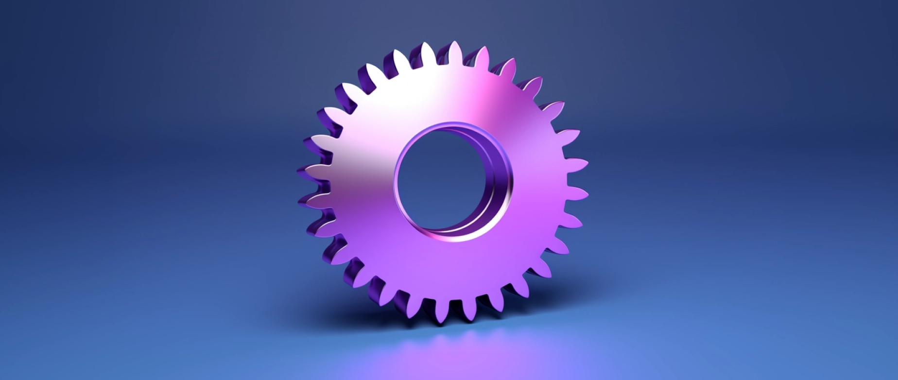 A shiny gear reflecting purple light against a navy background.