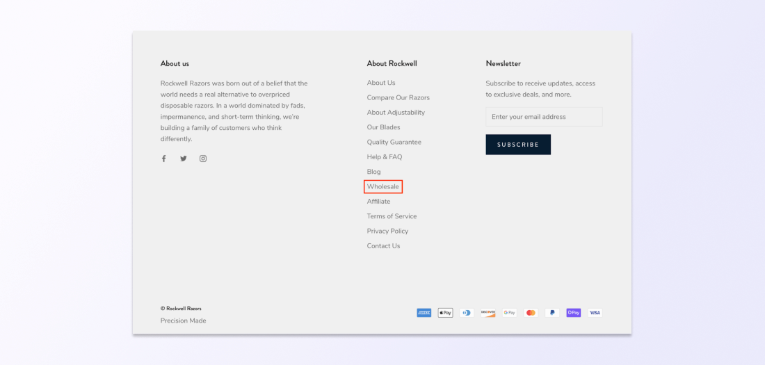 A link with the anchor “Wholesale” is found in the footer of ecommerce website Rockwell Razors.