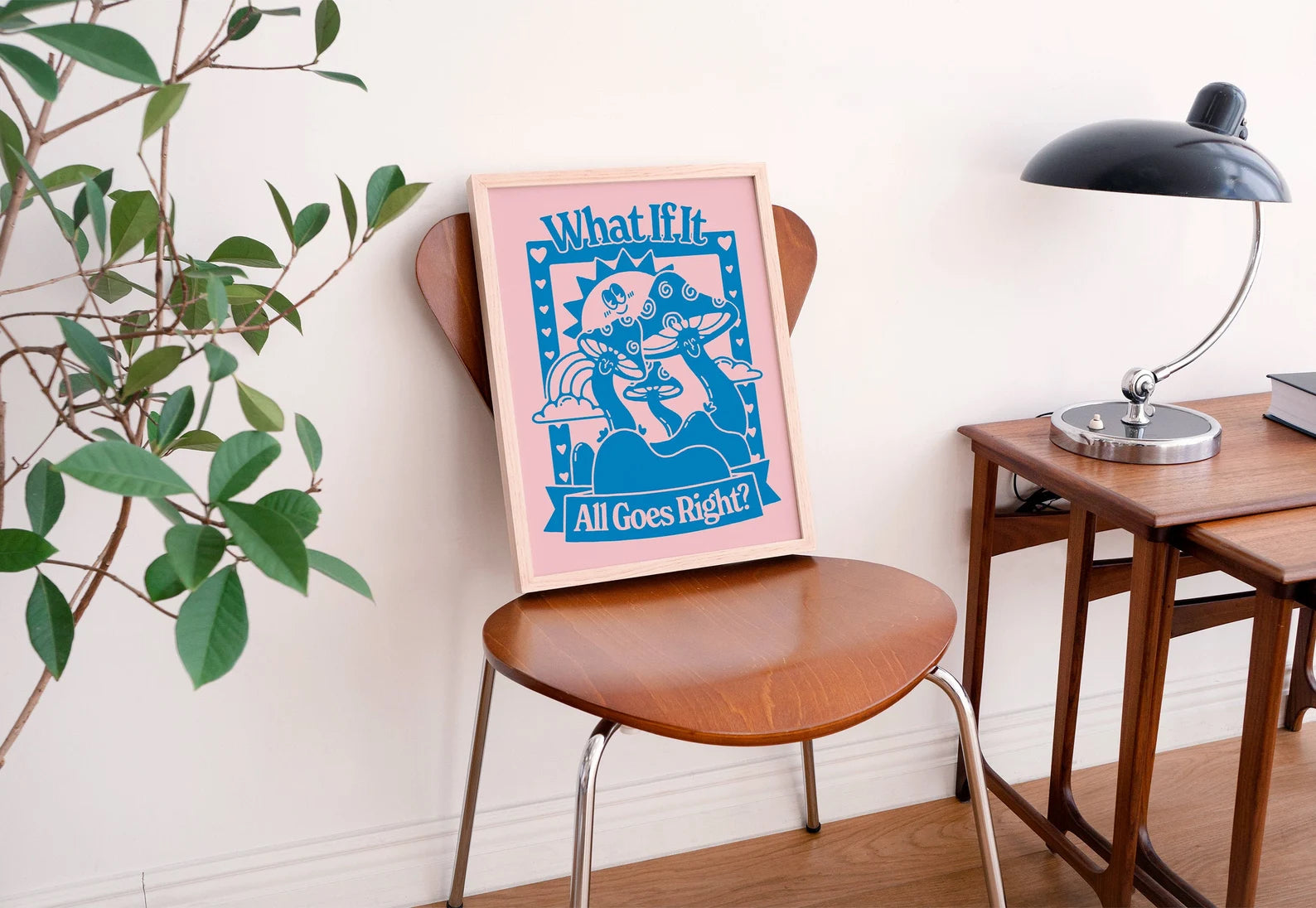 A graphic art print rests in a frame on a chair
