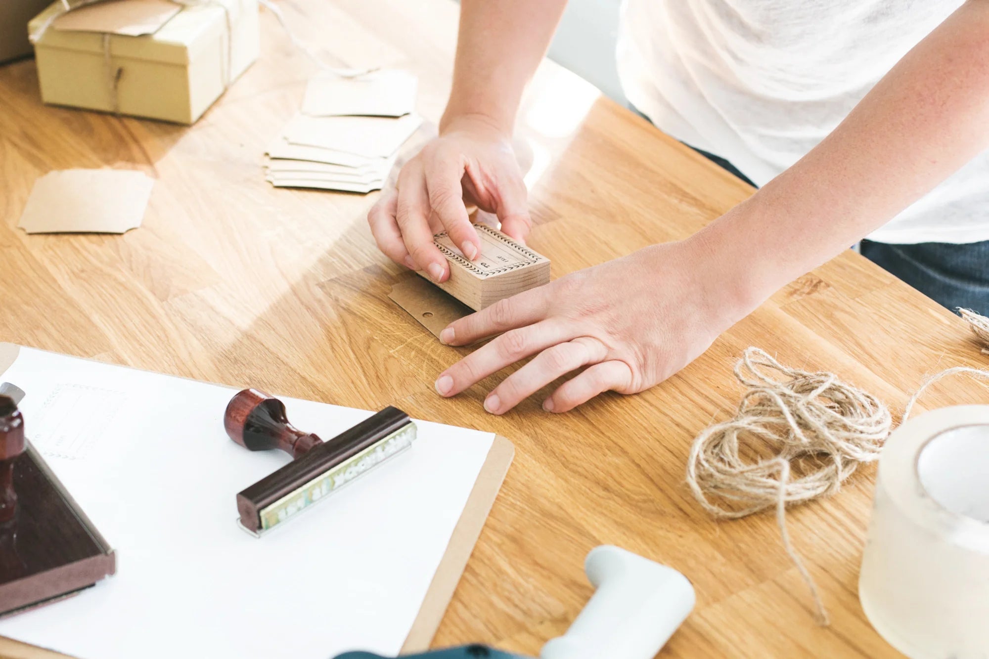 A person packages a handmade order