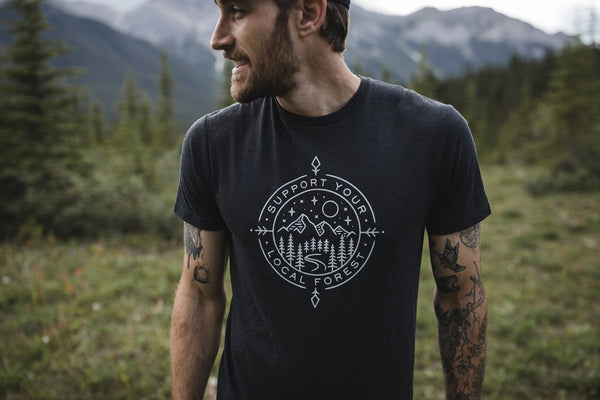 Photo of a man wearing a Tentree t-shirt in the wild