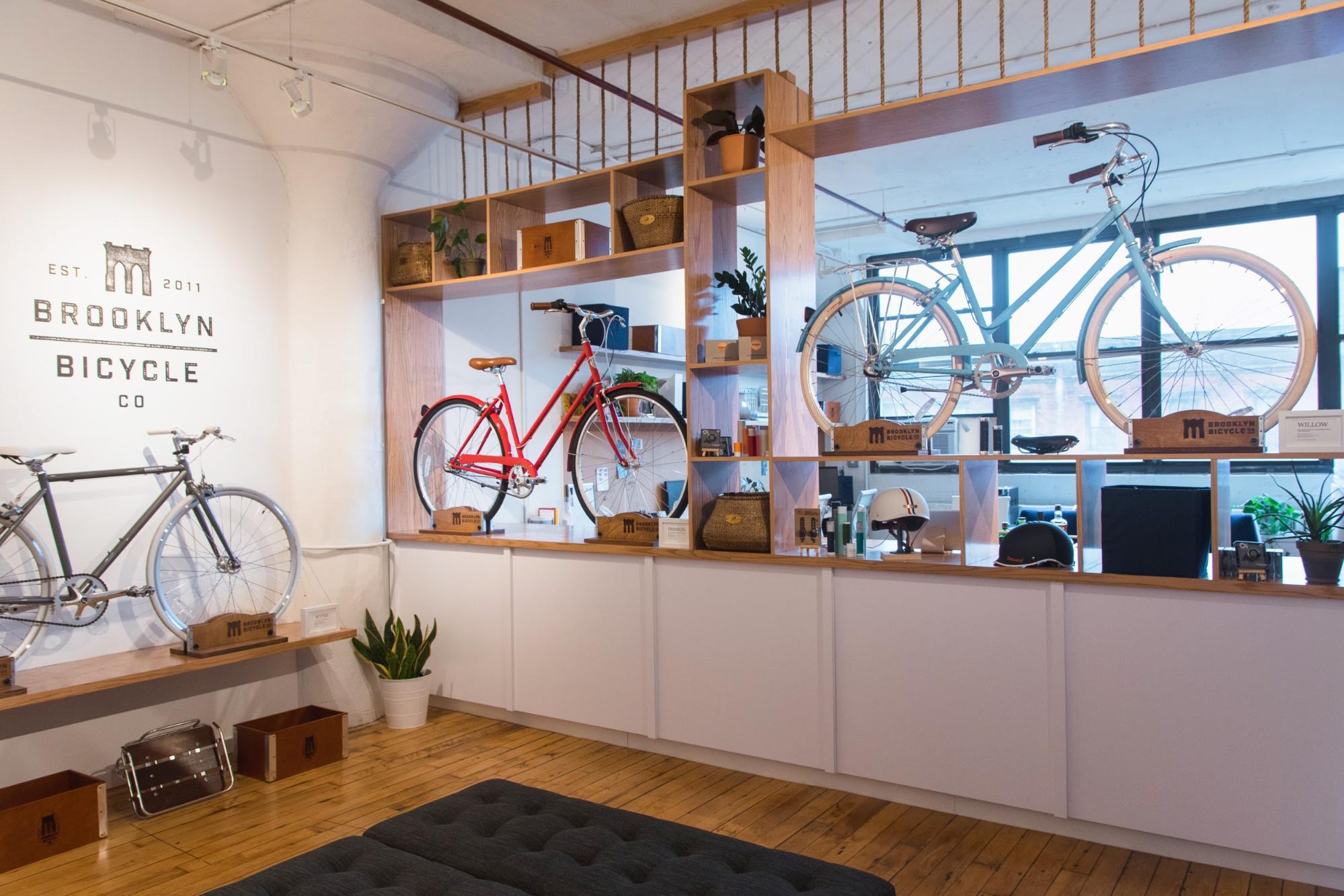 Three bikes displayed within the showroom of Brooklyn Bicycle Co.