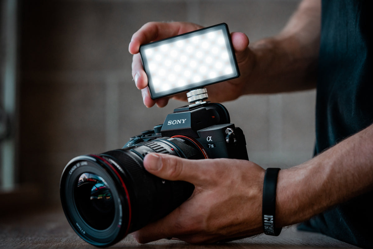 A sony digital SLR with a lights attachment from Lume Cube.