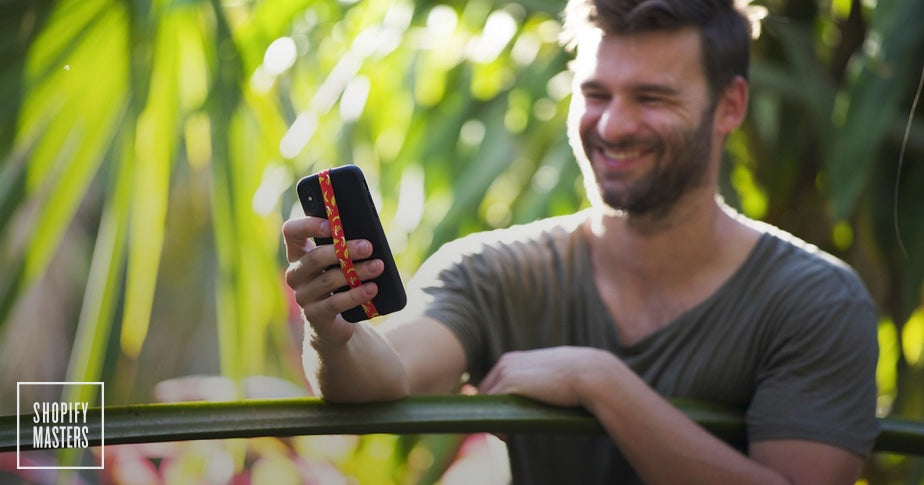 man looking at phone with phone loops