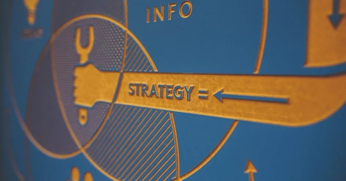 A blue and gold mural showing the relationship between “information” and “strategy.”